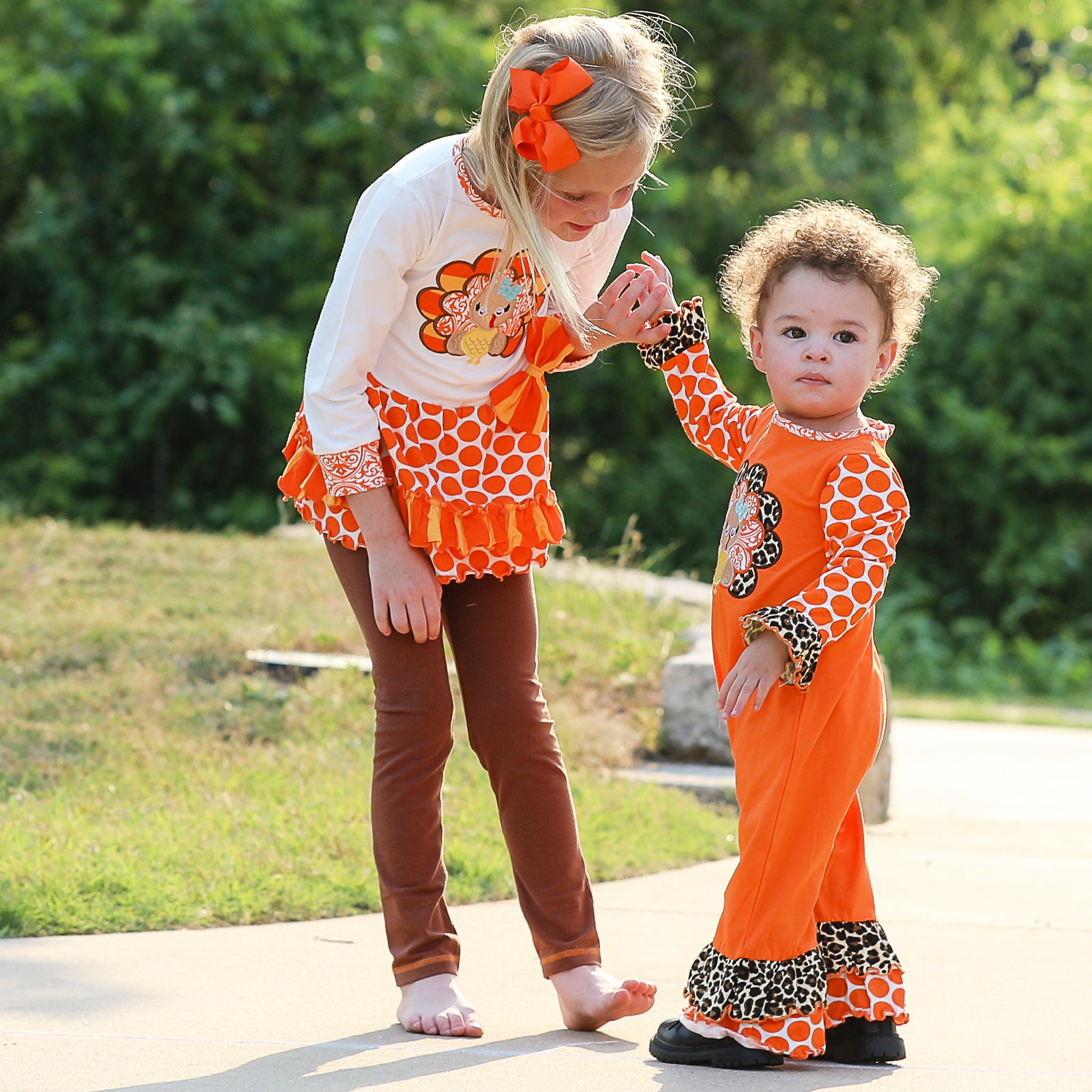 AnnLoren Big Little Girls Autumn Turkey Tunic & Leggings featuring a turkey applique, cream tunic, and orange knit leggings.